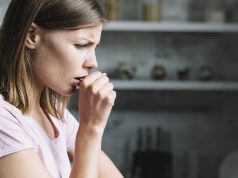 young woman coughing